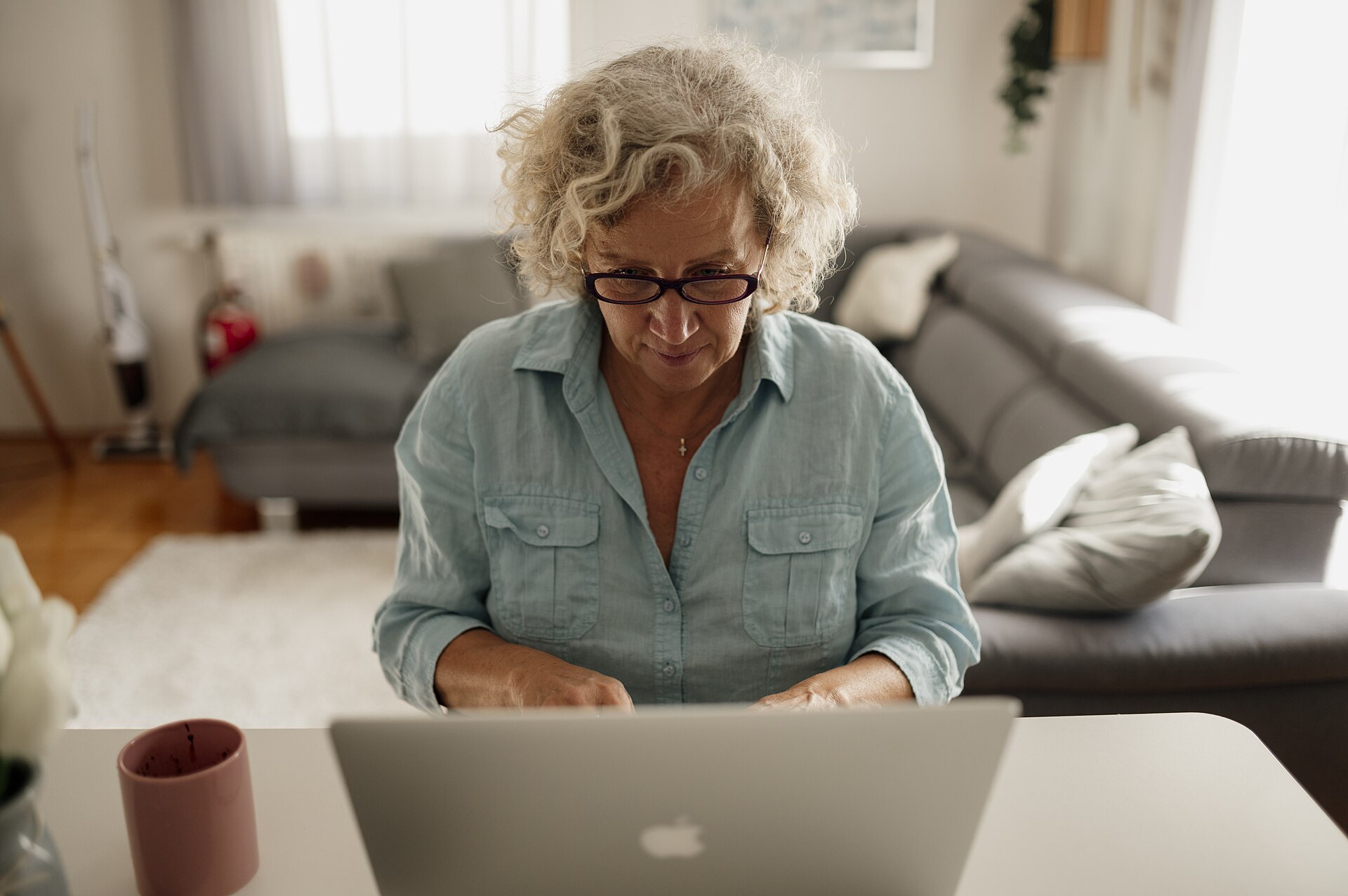 A woman getting comfortable with technology at home